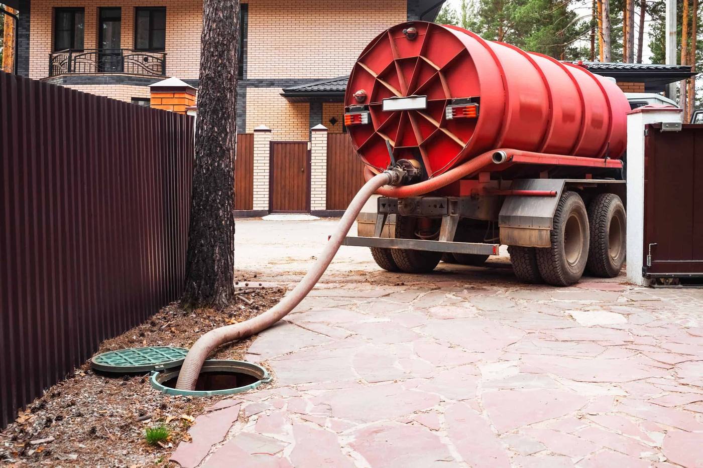 A septic pumping truck servicing an underground tank